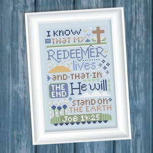 May include: Cross stitch pattern with blue and brown embroidery floss on a light blue background. The pattern features a cross, flowers, and the text "I know that my Redeemer lives and that in the end He will stand on the earth Job 19:25".