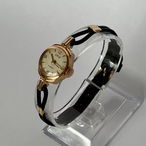 ORIS VINTAGE Ladies Gold Plated Cocktail Wristwatch on black cord leather strap. c.1950. REF No. 412