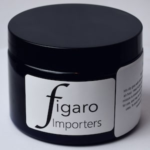May include: A black jar with a white label that says "figaro Importers". The label also includes instructions for mixing dry glue with water.
