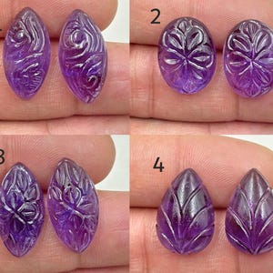 May include: Four pairs of carved amethyst gemstones, each pair with a unique design. The gemstones are purple and have a glossy finish. The pairs are labelled 1 through 4.