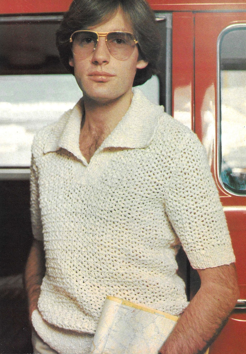 May include: A white crocheted short-sleeved shirt with a collared neckline. The shirt has a loose, open weave.