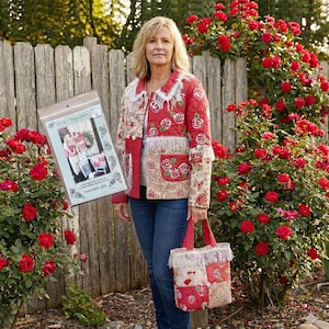 May include: A red quilted jacket with rose patterns, fringe trim, and patch pockets. The jacket is paired with a matching tote bag. A package with the text "Rose Garden" is held in the image. The background features a wooden fence and rose bushes.