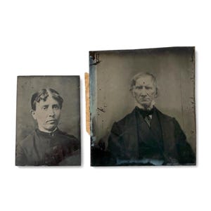 May include: Two antique tintype photographs featuring monochromatic portraits of individuals. The smaller portrait shows a person with dark hair, while the larger portrait depicts a person with light hair wearing a dark suit and a high-collared shirt.