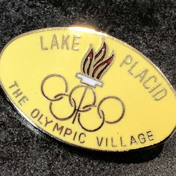 Pin Badge 1980 LAKE PLACID The Olympic Village Yellow Enamel Olympics