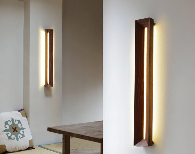 [Harmony] is a minimalist wood wall light, a linear wall lamp handmade of walnut wood, as wall art, home decor, bedroom decor. Also a perfect gift for him and gift for her.