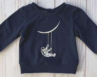 Crew neck space sweater for baby and toddler • Astronaut swinging by the moon • Nerdy baby shower gift • Navy blue graphic sweater