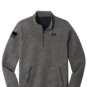 May include: A gray and black quarter-zip pullover sweatshirt with a black American flag on the left sleeve and a black logo of two crossed axes on the chest.