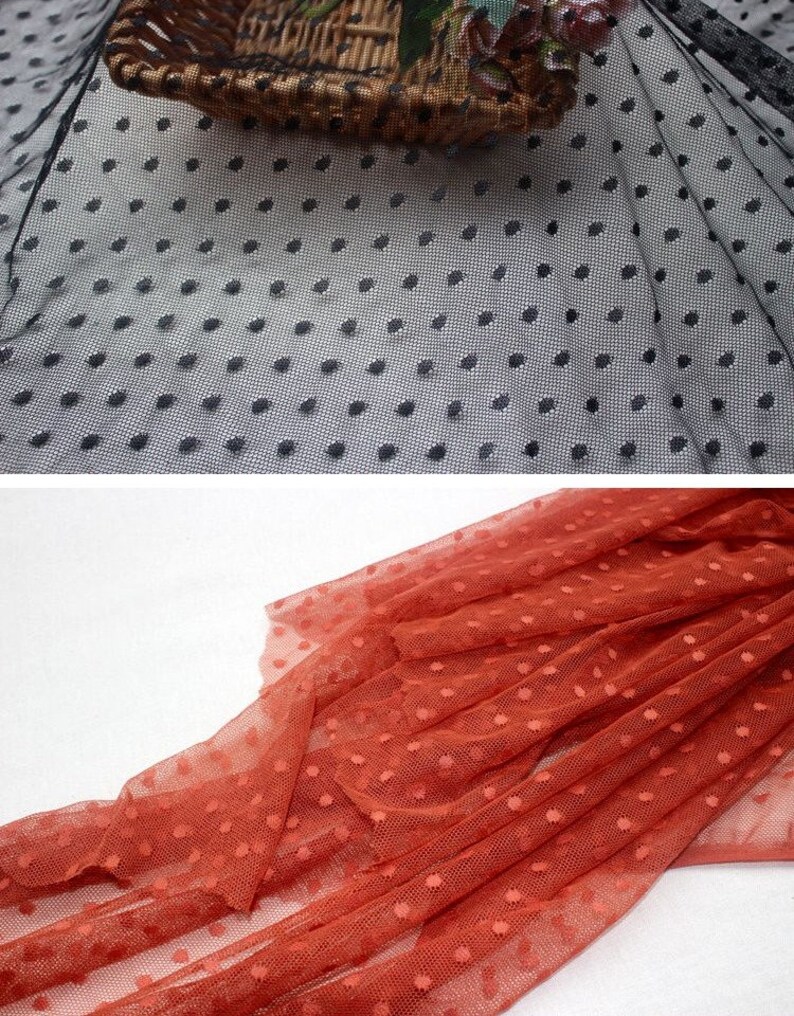 May include: Two pieces of black and orange dotted mesh fabric. The fabric is sheer and has a delicate texture.