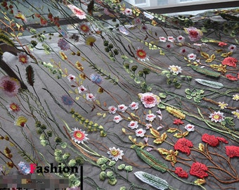 May include: Black sheer fabric with embroidered floral designs in shades of red, pink, yellow, green, and white.