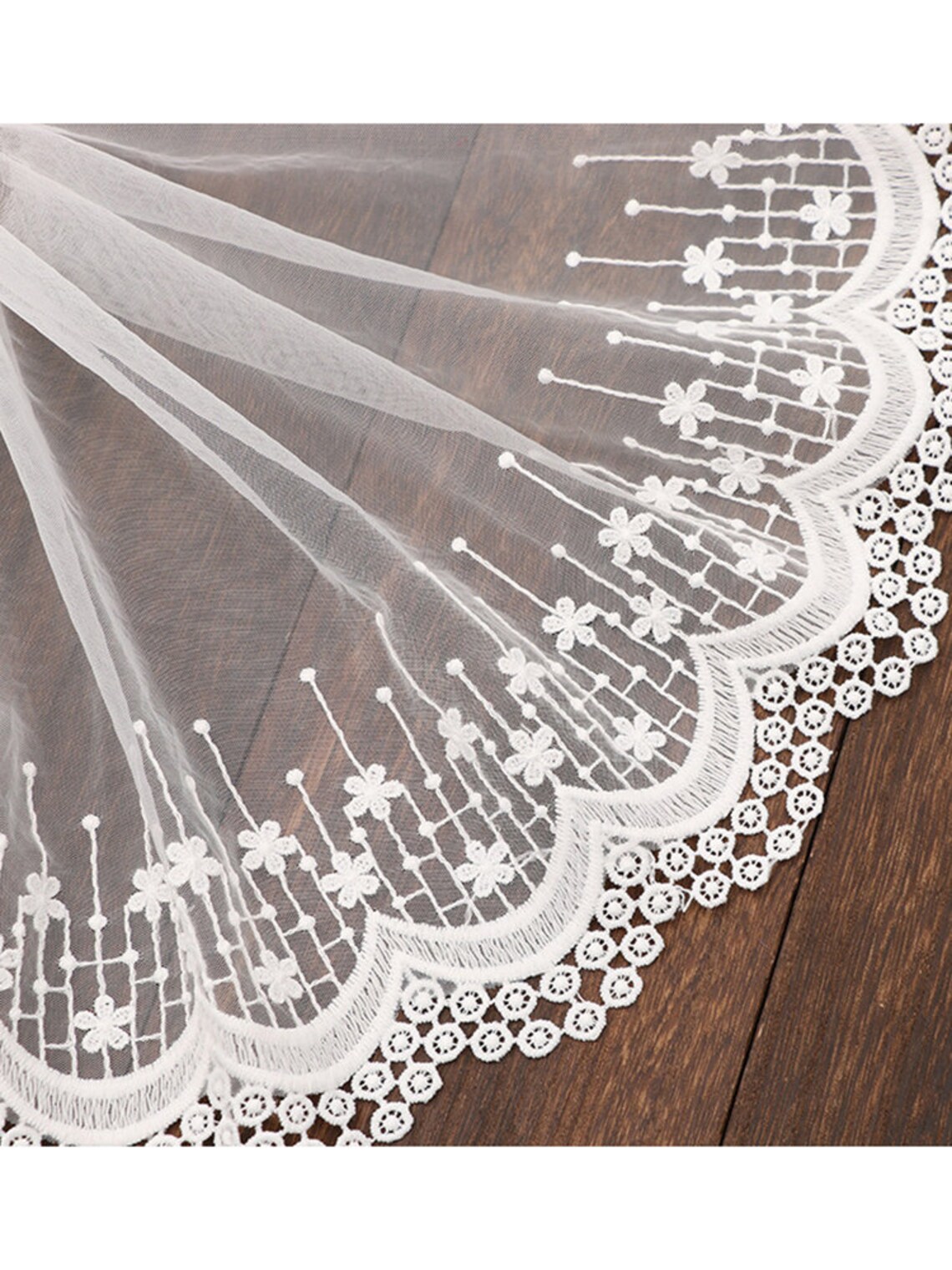 IVORY FLORAL DESIGN WITH CORD EMBROIDERY ON A MESH LACE-SOLD BY YARD. main image 1