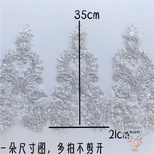 Puede incluir: Borde de encaje plateado con lentejuelas y diseño floral. El borde mide 35 cm de largo y 2 cm de ancho.