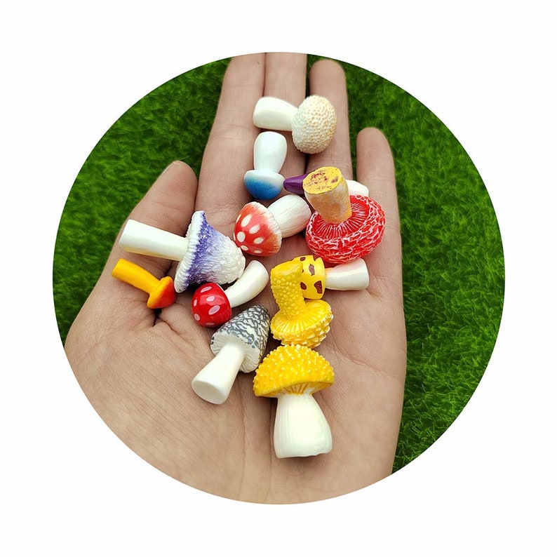 May include: A collection of miniature mushroom figurines in various colors, including red, yellow, purple, and white. The mushrooms have different shapes and textures, and some have spots or patterns.