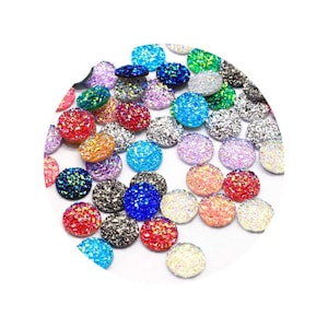 200 piezas de cristal AB de 12 mm con base plana de resina con puntos redondos de diamantes de imitación, cabujón de resina con base plana para decoración DIY y fabricación de pendientes.