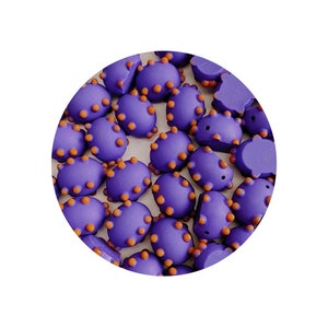 May include: A group of purple and orange beads with a bumpy texture. The beads are oval shaped and have small orange dots on the surface.