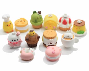 May include: A collection of 12 miniature figurines of various desserts and pastries, each featuring a cute cartoon animal character. The figurines are made of a soft, colorful material and are perfect for decorating a cake or adding a whimsical touch to a craft project.