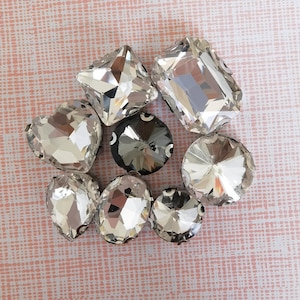 Gemas de cristal de formas variadas con parte trasera plana, diamantes de imitación blancos, costura plateada para joyería, ropa, zapatos y disfraces.