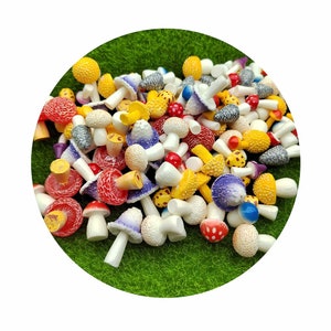 May include: A collection of colorful miniature mushroom figurines in various shades of red, yellow, purple, and white. The mushrooms are made of plastic and have a realistic appearance.