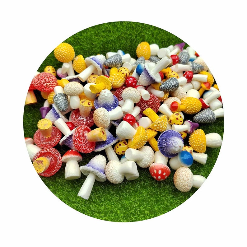 May include: A collection of colorful miniature mushroom figurines in various shades of red, yellow, purple, and white. The mushrooms are made of plastic and have a realistic appearance.