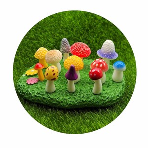 May include: A collection of miniature mushroom figurines in various colors, including red, yellow, purple, blue, and white, arranged on a green grassy surface.