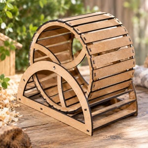 May include: A light brown wooden exercise wheel for small pets, featuring a cylindrical drum constructed from horizontal slats with dark edges, supported by a sturdy semi-circular frame base that allows the wheel to rotate freely.