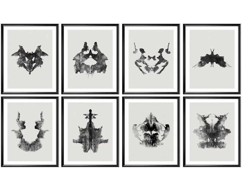 May include: Set of eight black and white inkblot prints in black frames. The inkblots are symmetrical and abstract.