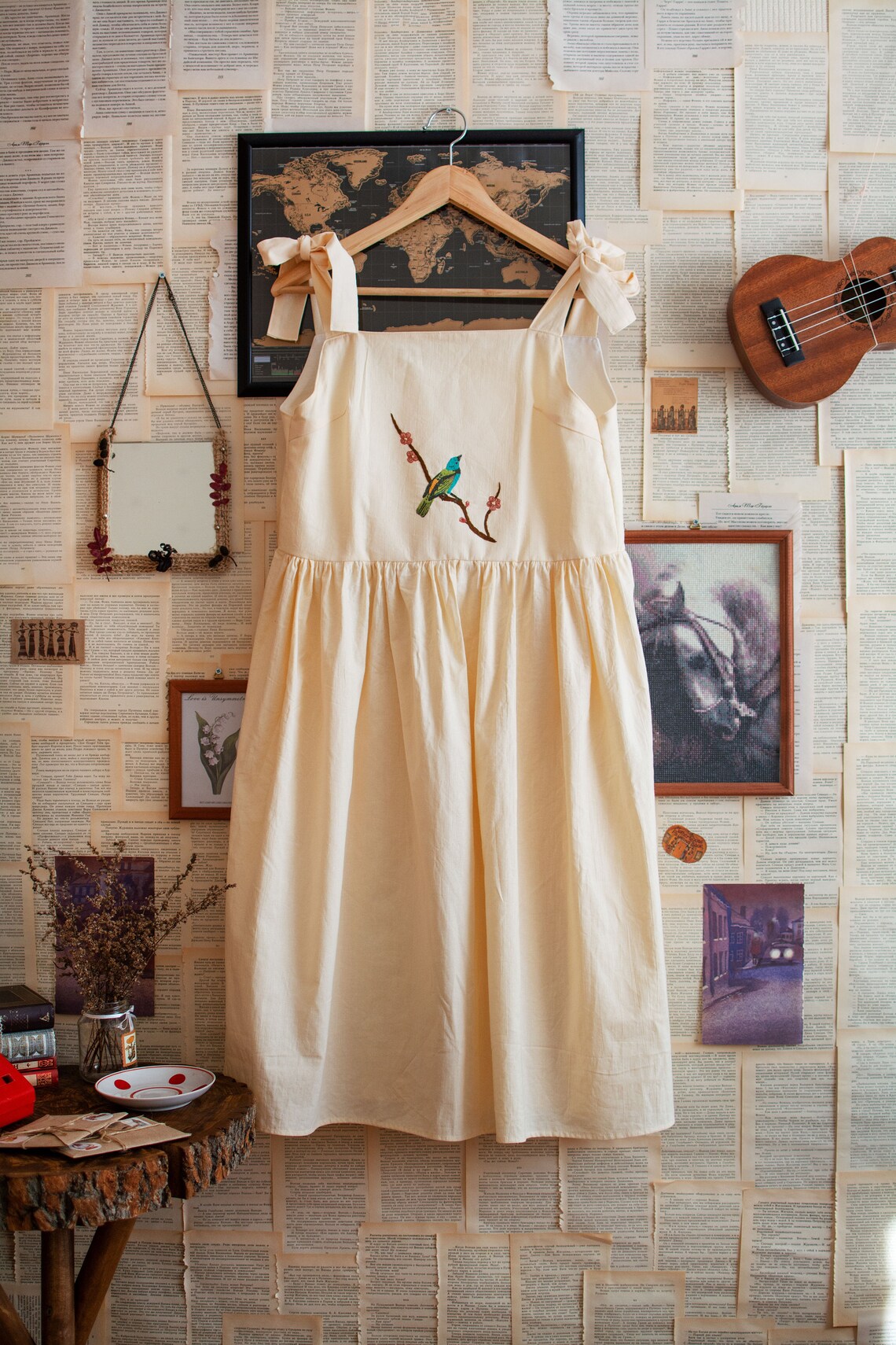beige pinafore dress