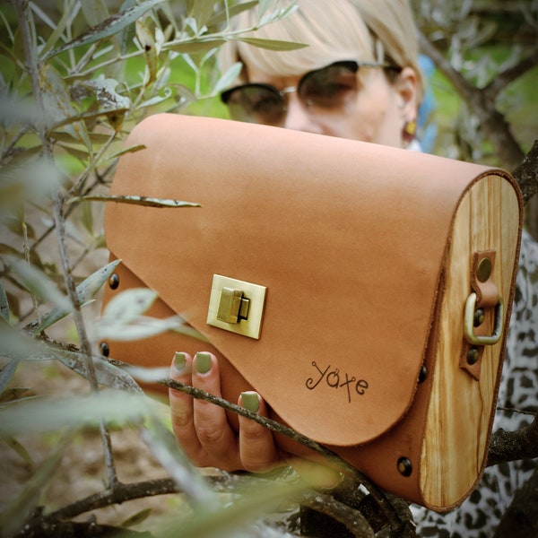 Brown color women bag. Handmade from olive tree wood and wuality leather. Can be weare as crossbody or clutch or purse