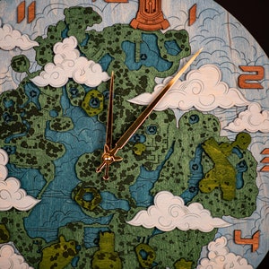 May include: A wooden clock face with a blue and green design. The clock face features a gold-colored hour and minute hand, and the numbers 1, 2, 3, and 4 are visible.