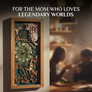 May include: Wooden framed wall clock with a map design. The clock face features a detailed, layered map in shades of green, brown, and blue. The clock hands are black, and the numbers are white. The text at the top reads, "FOR THE MOM WHO LOVES LEGENDARY WORLDS."
