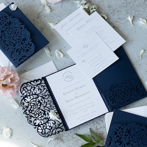 Navy blue wedding laser cut invitations in a folder with printing with your own text