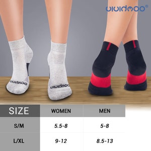 May include: Ankle socks in gray and navy blue with red accents. The socks are displayed on legs, showcasing the design and fit. The brand name "vividmoo" is visible. A size chart is included, indicating sizes S/M and L/XL for women and men.