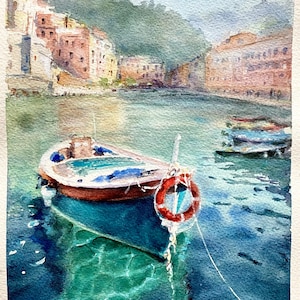 May include: Watercolour painting of a harbour scene with a small boat in the foreground. The boat has a red and white life preserver. Buildings line the shore in the background, and the water reflects the colours of the scene.