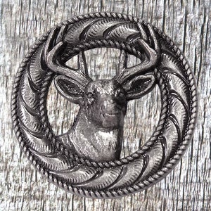 May include: A silver-toned metal button featuring a deer head with antlers inside a rope-like circle design.