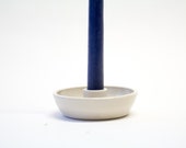 Small hand-made white candlestick with transparent glaze