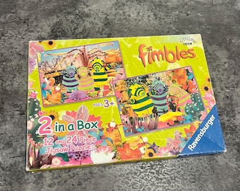 May include: A boxed set of two "Fimbles" jigsaw puzzles, with 12 and 24 pieces each, for ages 3+. The box features colorful illustrations of the Fimbles characters and floral elements on a light green background. The brand name "Ravensburger" is visible.