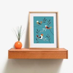 May include: A framed print with a teal background featuring three stylised birds with orange, red, white and black accents perched on branches with grey and green leaves.