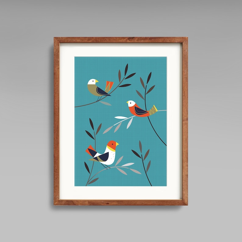 May include: A framed print with a teal background featuring three stylised birds with orange, white, and black accents perched on branches with grey leaves.