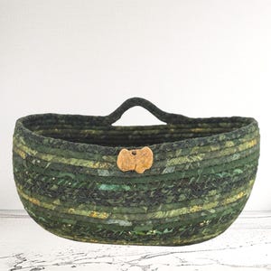 Medium Green Hanging Coiled Rope Basket – Handmade Wall Basket with Natural River Stone