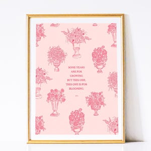 May include: Pink floral print with a quote that reads "Some years are for growing but this one, this one is for blooming."