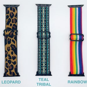 May include: Three different Apple Watch bands. The first band is leopard print, the second is teal with a tribal pattern, and the third is rainbow.