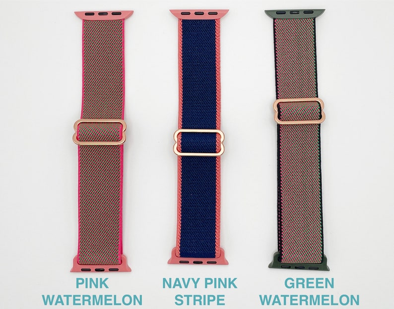 May include: Three Apple Watch bands in different colours and patterns. The band on the left is pink and brown with the text "PINK WATERMELON". The middle band is navy blue and pink with the text "NAVY PINK STRIPE". The band on the right is green and pink with the text "GREEN WATERMELON".