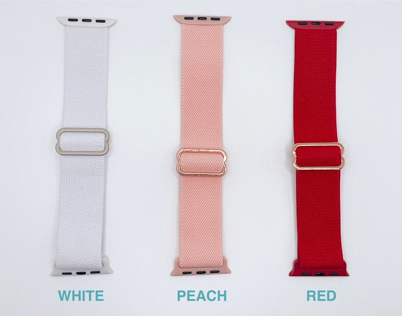 May include: Three Apple Watch bands in white, peach, and red. Each band has a rose gold buckle.