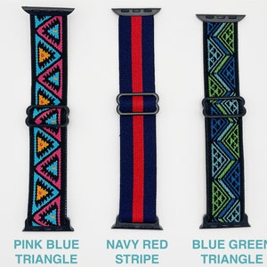 May include: Three Apple Watch bands with different patterns. The first band is pink, blue and yellow with a triangle pattern. The second band is navy blue and red with a stripe pattern. The third band is blue and green with a triangle pattern. The bands are all made of elastic material.