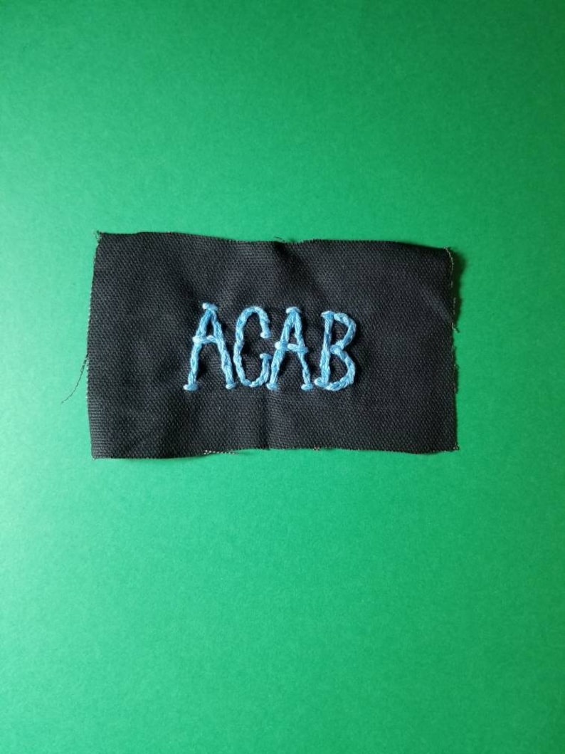 Hand stitched ACAB patch.