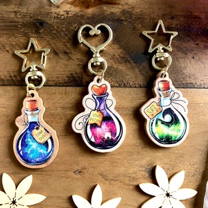 Magical potion keychains made of wood as dreamy accessories, lucky charms or gifts for Valentine's Day or weddings