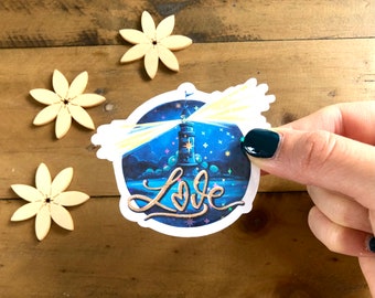 Runder blauer Glitzersticker mit Leuchtturm aus Aquarell und Handlettering "Liebe" als Geschenk zum Valentinstag oder Bullet Journal Deko