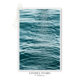 May include: A close-up photograph of rippling turquoise water with sunlight reflecting on the surface.