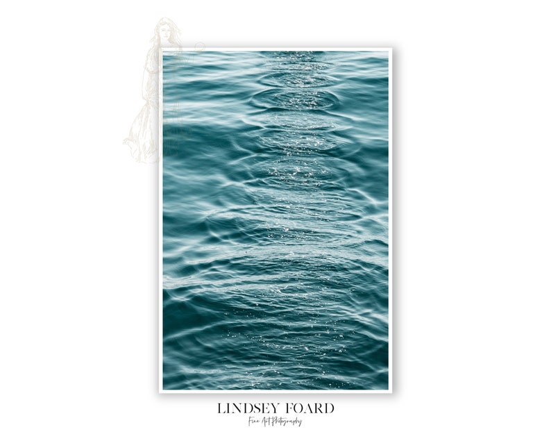 May include: A close-up photograph of rippling turquoise water with sunlight reflecting on the surface.