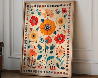 Op de afbeelding: Een ingelijste print met een kleurrijk bloemenontwerp met verschillende bloemen in tinten rood, oranje, geel en blauw. De bloemen zijn symmetrisch gerangschikt op een crèmekleurige achtergrond.