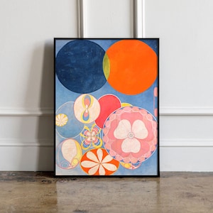 May include: Abstract art print featuring a composition of colorful circles and floral-like shapes. The artwork includes a large dark blue circle, an orange circle, and various smaller circles in shades of pink, yellow, and blue, all set against a light blue background.